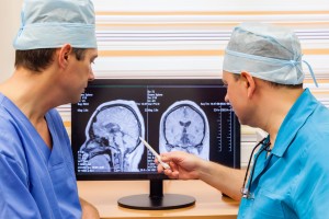 Two doctors examining an MRI scan